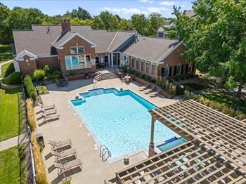 A large house with a pool in the backyard.